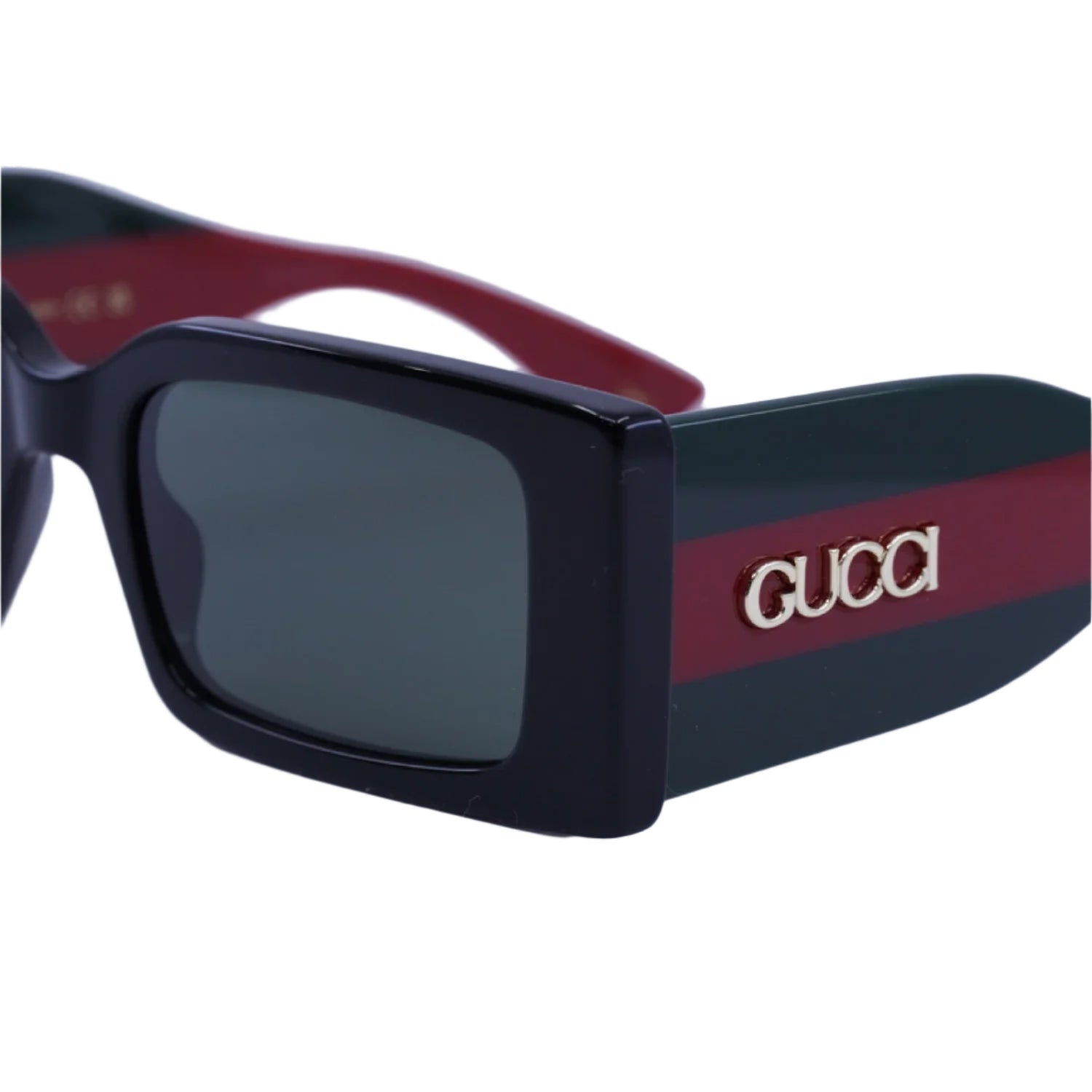 Black sunglasses with red and gold Gucci logo on a light gray background