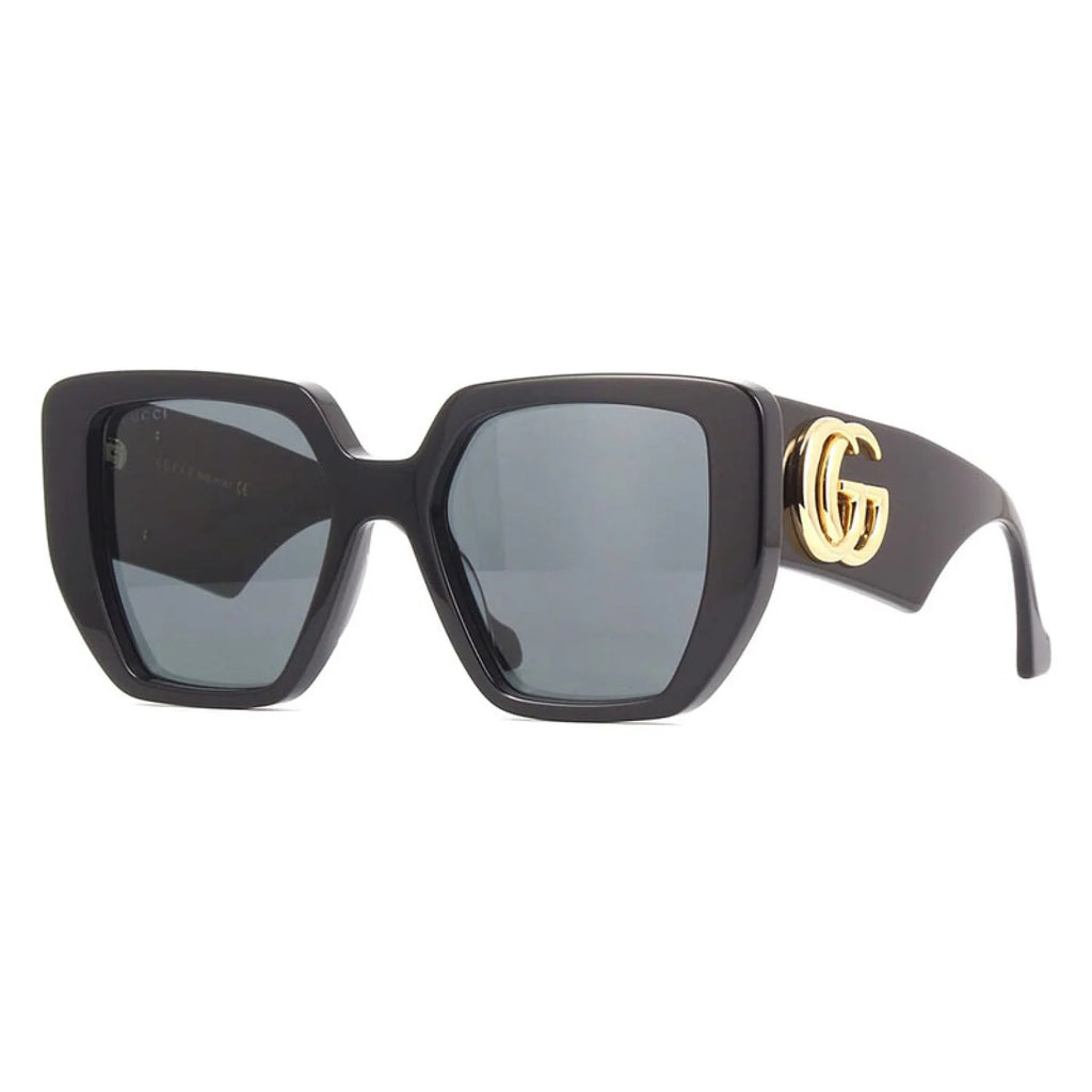 Black Gucci sunglasses with gold accents